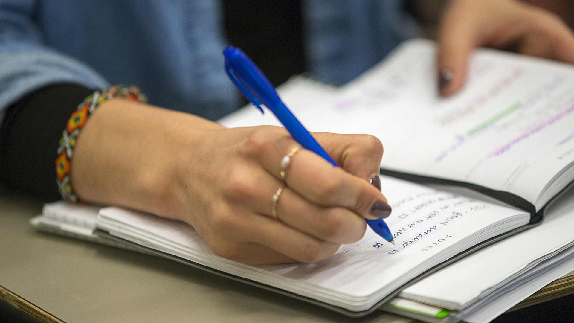 Writing in notebook