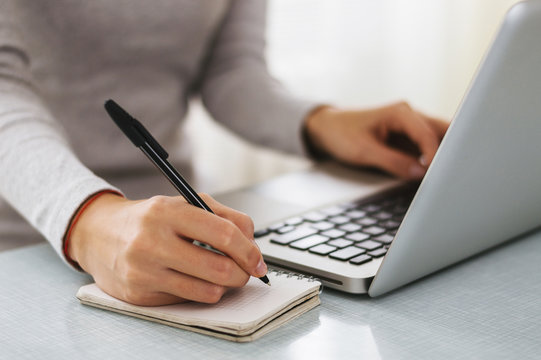 Laptop and notepad